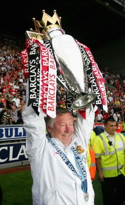 WIGAN, UNITED KINGDOM - MAY 11:  Manchester United Manager Sir Alex Ferguson holds the Barclays Premier League trophy aloft at the end of the Barclays Premier League match between Wigan Athletic and Manchester United at The JJB Stadium on May 11, 2008 in 