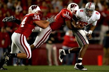 MADISON, WI - OCTOBER 04:  Quarterback Terrelle Pryor #2 of the Ohio State Buckeyes is sacked by Mike Newkirk #54 and DeAndre Levy #11 of the Wisconsin Badgers at Camp Randall Stadium  October 4, 2008 in Madison, Wisconsin.  (Photo by Matthew Stockman/Get