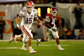 MIAMI - JANUARY 08:  Tim Tebow #15 of the Florida Gators rolls out to pass against the Oklahoma Sooners during the FedEx BCS National Championship game at Dolphin Stadium on January 8, 2009 in Miami, Florida.  (Photo by Marc Serota/Getty Images)