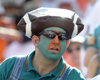 MIAMI, FL - JANUARY 4:  A fan of the Miami Dolphins sports team colors before play against the Baltimore Ravens in an NFL Wildcard Playoff Game at Dolphins Stadium on January 4, 2009 in Miami, Florida.  (Photo by Al Messerschmidt/Getty Images)