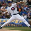 CHICAGO - APRIL 15: Starting pitcher Rich Harden of the Chicago Cubs, wearing a #42 jersey during the Jackie Robinson Day game, delivers the ball against the Colorado Rockies on April 15, 2009 at Wrigley Field in Chicago, Illinois. (Photo by Jonathan Dani
