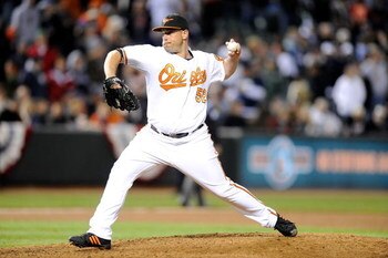 BALTIMORE - APRIL 8:  George Sherrill #52 of the Baltimore Orioles pitches against the New York Yankees at Camden Yards April 8, 2009 in Baltimore, Maryland.  (Photo by Greg Fiume/Getty Images)