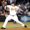 BALTIMORE - APRIL 8:  George Sherrill #52 of the Baltimore Orioles pitches against the New York Yankees at Camden Yards April 8, 2009 in Baltimore, Maryland.  (Photo by Greg Fiume/Getty Images)