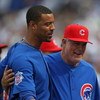 CHICAGO - JULY 03: Derrek Lee #25 and Manager Lou Piniella #41 of the Chicago Cubs celebrate a win over the Milwaukee Brewers on July 3, 2009 at Wrigley Field in Chicago, Illinois. The Cubs defeated the Brewers 2-1 in 10 innings. (Photo by Jonathan Daniel