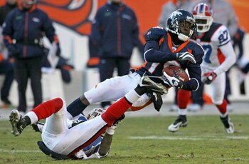 DENVER - DECEMBER 21:  Wide receiver Eddie Royal #19 of the Denver Broncos makes a reception as cornerback Leodis McKelvin #28 of the Buffalo Bills makes the tackle during NFL action at Invesco Field at Mile High on December 21, 2008 in Denver, Colorado. 
