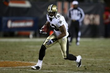 CHICAGO - DECEMBER 11:  Marques Colston #12 of the New Orleans Saints runs for yards after the catch against the Chicago Bears at Soldier Field on December 11, 2008 in Chicago, Illinois.  (Photo by Jonathan Daniel/Getty Images)