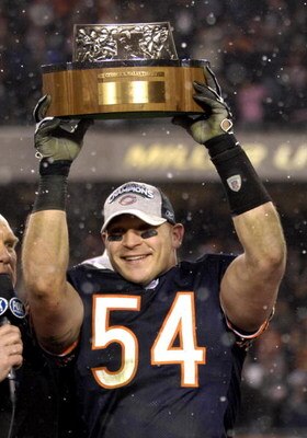 Brian Urlacher holds up the George Halas trophy after the Bears won the 2006 NFC title game to earn the right to the Super Bowl.  In order to see a repeat of this even the Bears have to get production from two players who played a combined one play in the pre-season.