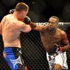 LAS VEGAS - JULY 11:  (R-L) Jon Jones connects with a right punch on Jake O'Brein during their light heavyweight bout during UFC 100 on July 11, 2009 in Las Vegas, Nevada. Jones defeated O'Brein by second round tapout.  (Photo by Jon Kopaloff/Getty Images