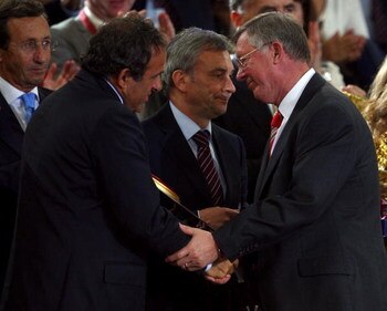 ROME - MAY 27:  Sir Alex Ferguson manager of Manchester United is greeted by Uefa president Michel Platini after Manchester United lost the UEFA Champions League Final match between Barcelona and Manchester United at the Stadio Olimpico on May 27, 2009 in