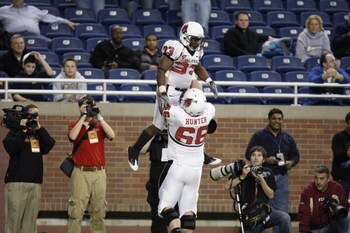 DETROIT - DECEMBER 5:  MiQuale Lewis #33 of the Ball State Cardinals is lifted in the air by teammate Kreg Hunger #66 as they celebrate against the Buffalo Bulls during the MAC Championship game on December 5, 2008 at Ford Field in Detroit Michigan. (Phot