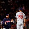 BOSTON - OCTOBER 13:  Jensen Lewis #50 of the Cleveland Indians stands on the mound as manager Eric Wedge walks in to pull him from the game in the seventh inning against the Boston Red Sox during Game Two of the American League Championship Series at Fen