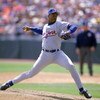 DENVER - APRIL 15:  Dwight Gooden #16 of the New York Mets winds up for a pitch during a game against the Colorado Rockies at Coors Field on April 15, 1993 in Denver, Colorado.  (Photo by Tim DeFrisco/Getty Images)