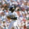 OAKLAND, CA - 1989:  Dave Stewart #34 of the Oakland Athletics pitches during a game in the 1989 season at Oakland-Alameda Coliseum in Oakland, California. (Photo by Otto Greule Jr/Getty Images)