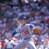 CHICAGO - 1987:  Orel Hershiser #55 of the Los Angeles Dodgers pitches against the Chicago Cubs in the 1987 season at Wrigley Field in Chicago, Illinois.  (Photo by Jonathan Daniel/Getty Images)