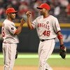 PHOENIX - JUNE 27:  Chone Figgins #9 and Torii Hunter #48 of the Los Angeles Angels of Anaheim celebrate after defeating the Arizona Diamondbacks during the major league baseball game at Chase Field on June 27, 2009 in Phoenix, Arizona. The Angels defeate