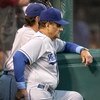 ANAHEIM, CA - JUNE 21:   Manager Joe Torre of the Los Angeles Dodgers  looks on from the dugout during the game with the Los Angeles Angels of Anaheim on June 21, 2009 at Angel Stadium in Anaheim, California.   The Dodgers won 5-3. (Photo by Stephen Dunn/
