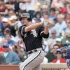 CHICAGO - JUNE 17: Paul Konerko #14 of the Chicago White Sox swings at the pitch against the Chicago Cubs on June 17, 2009 at Wrigley Field in Chicago, Illinois. (Photo by Jonathan Daniel/Getty Images)