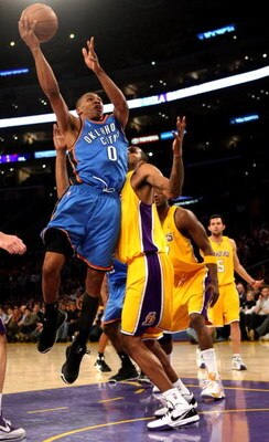 LOS ANGELES - FEBRUARY 10:  Russell Westbrook #0 of the Oklahoma City Thunder shoots over Trevor Ariza #3 of the Los Angeles Lakers on February 10, 2009 at Staples Center in Los Angeles, California.  The Lakers won 105-98.   NOTE TO USER: User expressly a