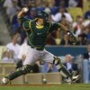 LOS ANGELES, CA - JUNE 16:  Kurt Suzuki #8 of the Oakland Athletics fields against the Los Angeles Dodgers at Dodger Stadium on June 16, 2009 in Los Angeles, California. The Dodgers defeated the Athletics 5-4 in ten innings.  (Photo by Jeff Gross/Getty Im