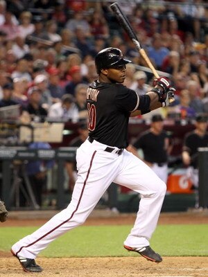 PHOENIX - MAY 30:  Justin Upton #10 of the Arizona Diamondbacks bats against the Atlanta Braves during the major league baseball game at Chase Field on May 30, 2009 in Phoenix, Arizona. The Diamondbacks defeated the Braves 3-2.  (Photo by Christian Peters