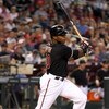 PHOENIX - MAY 30:  Justin Upton #10 of the Arizona Diamondbacks bats against the Atlanta Braves during the major league baseball game at Chase Field on May 30, 2009 in Phoenix, Arizona. The Diamondbacks defeated the Braves 3-2.  (Photo by Christian Peters