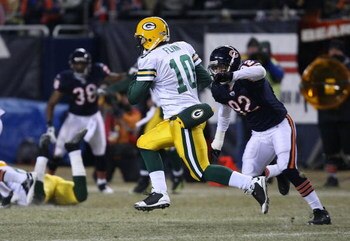 CHICAGO - DECEMBER 22: Matt Flynn #10 of the Green Bay Packers runs for a first down on a fake punt against the Chicago Bears on December 22, 2008 at Soldier Field in Chicago, Illinois. The Bears defeated the Packers 20-17 in overtime. (Photo by Jonathan 