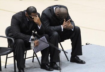 HATTIESBURG, MS - JULY 11:  Baltimore Ravens player Ray Lewis, left, and Tennessee Titans quarterback Vince Young react during funeral services for former NFL quarterback Steve McNair on July 11, 2009 in Hattiesburg, Mississippi.  (Photo by George Clark -