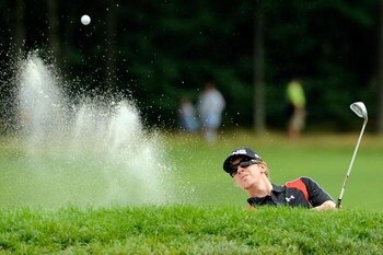 FARMINGDALE, NY - JUNE 22:  Hunter Mahan plays a bunker shot on the ninth hole during the continuation of the final round of the 109th U.S. Open on the Black Course at Bethpage State Park on June 22, 2009 in Farmingdale, New York.  (Photo by Sam Greenwood