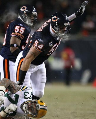 CHICAGO - DECEMBER 22: Brian Urlacher #54 of the Chicago Bears sheds a block by Daryn Colledge #73 of the Green Bay Packers on December 22, 2008 at Soldier Field in Chicago, Illinois. (Photo by Jonathan Daniel/Getty Images)
