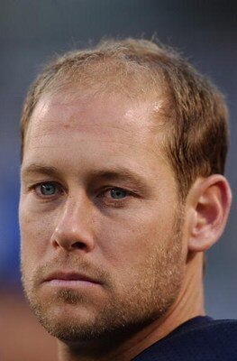 CHICAGO - AUGUST 21:  Brad Maynard of the Chicago Bears looks on from the sideline against the San Francisco 49ers during the preseason NFL game on August 21, 2004 at Soldier Field in Chicago, Illinois. The Bears defeated the 49ers 20-13.  (Photo by Jonat