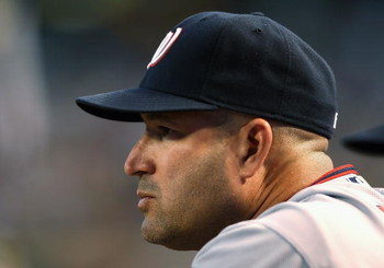 PHOENIX - MAY 08:  Manager Manny Acta #14 of the Washington Nationals looks on from the dugout during the game against the Arizona Diamondbacks at Chase Field on May 8, 2009 in Phoenix, Arizona.  (Photo by Christian Petersen/Getty Images)