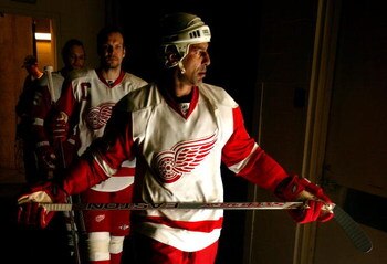 DALLAS - MAY 14:  Chris Chelios #24 and Nicklas Lidstrom #5 of the Detroit Red Wings walk out onto the ice for warm ups before game four of the Western Conference Finals of the 2008 NHL Stanley Cup Playoffs against the Dallas Stars at American Airlines Ce