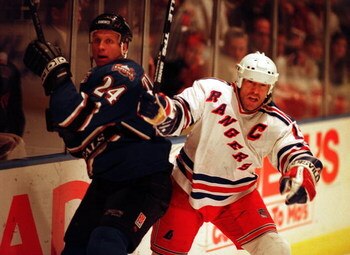 23  Oct 1996:  Mark Messier of the New York Rangers in action against Mark Tinordi of the Washington Capitals at Madison Square Garden in New York, New York. Mandatory Credit: Al Bello/Allsport