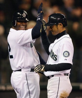 SEATTLE - APRIL 15:  Ichiro Suzuki (R) of the Seattle Mariners is congratulated by Ken Griffey, Jr. after hitting a grand slam against the Los Angeles Angels of Anaheim at Safeco Field April 15, 2009 in Seattle, Washington. The hit tied Suzuki with Isao H