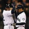 SEATTLE - APRIL 15:  Ichiro Suzuki (R) of the Seattle Mariners is congratulated by Ken Griffey, Jr. after hitting a grand slam against the Los Angeles Angels of Anaheim at Safeco Field April 15, 2009 in Seattle, Washington. The hit tied Suzuki with Isao H