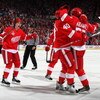DETROIT - JUNE 06:  Niklas Kronwall #55 of the Detroit Red Wings celebrates with Jiri Hudler #26 and Henrik Zetterberg after scoring a goal in the second period against the Pittsburgh Penguins during Game Five of the 2009 NHL Stanley Cup Finals at Joe Lou