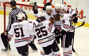 DETROIT - MAY 19:  (L-R) Brian Campbell #51, Cam Barker #25, Patrick Sharp #10, Martin Havlat #24 and Jonathan Toews #19 of the Chicago Blackhawks celebrate after Toews scored a power play goal in the first period against the Detroit Red Wings during Game