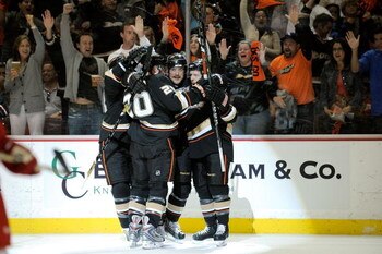 ANAHEIM, CA - MAY 05:  Teemu Selanne #8 of the Anaheim Ducks celebrates with teammates Andrew Ebbett #48 and Ryan Carter #20 after scoring the first goal against the Detroit Red Wings in the first period of Game Three of the Western Conference Semifinal R