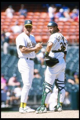 2 May 1996:  Manager Art Howe and catcher Terry Steinbach of the Oakland Athletics confer on the pitchers mound during a game against the Anaheim Angels at the Oakland Alameda Coliseum in Oakland, California.  The Angels won the game 3-1. Mandatory Credit