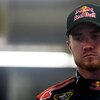 CONCORD, NC - OCTOBER 15:  Brian Vickers, driver of the #83 Red Bull Toyota, stands in the garage during practice for the NASCAR Sprint Cup Series NASCAR Banking 500 at Lowe's Motor Speedway on October 15, 2009 in Concord, North Carolina.  (Photo by Jason