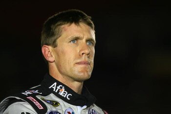 CONCORD, NC - OCTOBER 15:  Carl Edwards, driver of the #99 Aflac Ford, stands on pit road during qualifying for the NASCAR Sprint Cup Series NASCAR Banking 500 at Lowe's Motor Speedway on October 15, 2009 in Concord, North Carolina.  (Photo by Jason Smith
