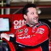 FONTANA, CA - OCTOBER 09:  Tony Stewart, driver of the #14 Office Depot/Old Spice Chevrolet, climbs into his car during practice for the NASCAR Sprint Cup Series Pepsi 500 at Auto Club Speedway on October 9, 2009 in Fontana, California.  (Photo by Chris G