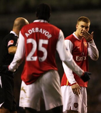 LONDON - JANUARY 22:  Referee Howard Webb sorts out an altercation between Nicklas Bendtner and Emmanuel Adebayor of Arsenal during the Carling Cup Semi-final second leg match between Tottenham Hotspur and Arsenal at White Hart Lane on January 22, 2007 in