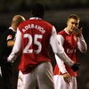 LONDON - JANUARY 22:  Referee Howard Webb sorts out an altercation between Nicklas Bendtner and Emmanuel Adebayor of Arsenal during the Carling Cup Semi-final second leg match between Tottenham Hotspur and Arsenal at White Hart Lane on January 22, 2007 in
