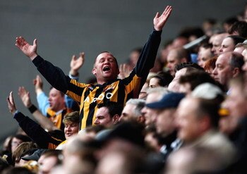 WIGAN, UNITED KINGDOM - MARCH 22:  A Hull fan makes himself heard during the Barclays Premier League match between Wigan Athletic and Hull City at The JJB Stadium on March 22, 2009 in Wigan, England.  (Photo by Laurence Griffiths/Getty Images)