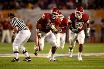 MIAMI - JANUARY 08:  Gerald McCoy #93 of the Oklahoma Sooners returns an interception for positive yardage in the first half against the Florida Gators during the FedEx BCS National Championship game at Dolphin Stadium on January 8, 2009 in Miami, Florida
