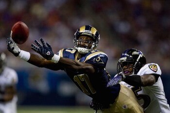 ST. LOUIS, MO - AUGUST 23: Donnie Avery #17 of the St. Louis Rams attempts to make a catch against Corey Ivy #35 of the Baltimore Ravens at the Edward Jones Dome August 23, 2008 in St. Louis, Missouri. (Photo by Dilip Vishwanat/Getty Images)