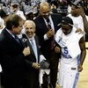 MEMPHIS, TN - MARCH 29:  CBS broadcasters Jim Nantz (L) and Clark Kellogg (2nd R) interview head coach Roy Williams (2nd L) and Ty Lawson #5 (R) of the North Carolina Tar Heels after the Tar Heels defeated the Oklahoma Sooners during the NCAA Men's Basket