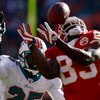 KANSAS CITY, MO - DECEMBER 21:  Mark Bradley #83 of Kansas City Chiefs tries to make a reception as Will Allen #25 of the Miami Dolphins looks on during the game on December 21, 2008 at Arrowhead Stadium in Kansas City, Missouri.  (Photo by Jamie Squire/G