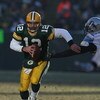 GREEN BAY, WI - DECEMBER 28: Aaron Rodgers #12 of the Green Bay Packers breaks away from Cliff Avril #92 of the Detroit Lions on December 28, 2008 at Lambeau Field in Green Bay, Wisconsin. The Packers defeated the Lions 31-21. (Photo by Jonathan Daniel/Ge